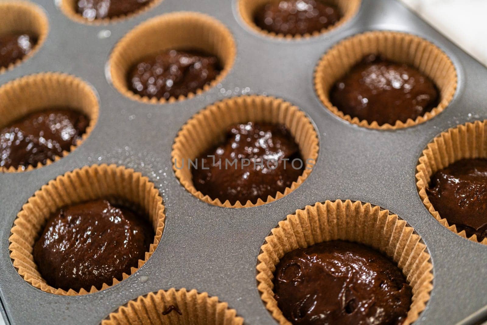 Baking Chocolate Cupcakes with Decadent Chocolate Frosting by arinahabich