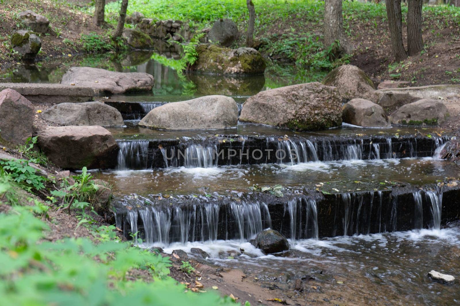 small artificial waterfall in the park.