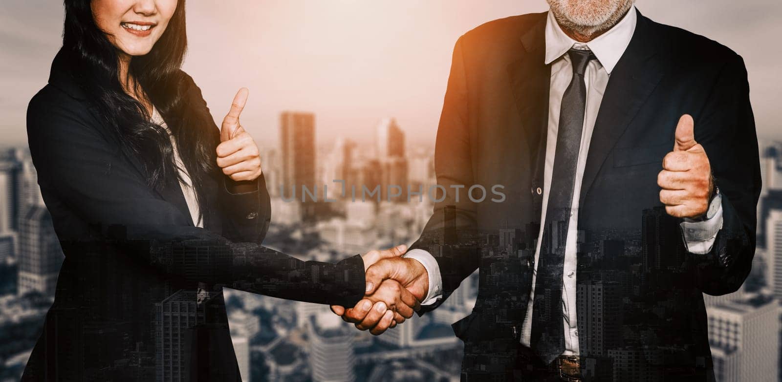 Double exposure image of business people handshake on city office building in background show partnership success of business deal. Concept of corporate teamwork, trust partner and work agreement. uds