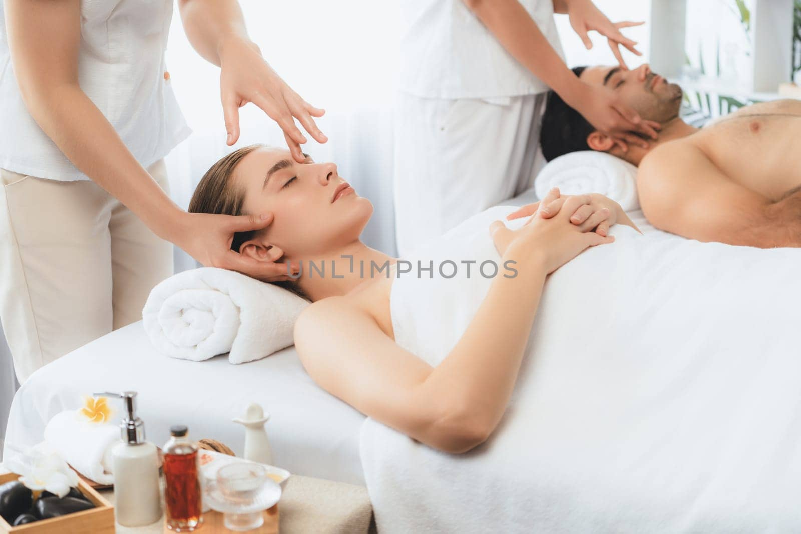 Caucasian couple enjoying relaxing anti-stress head massage. Quiescent by biancoblue