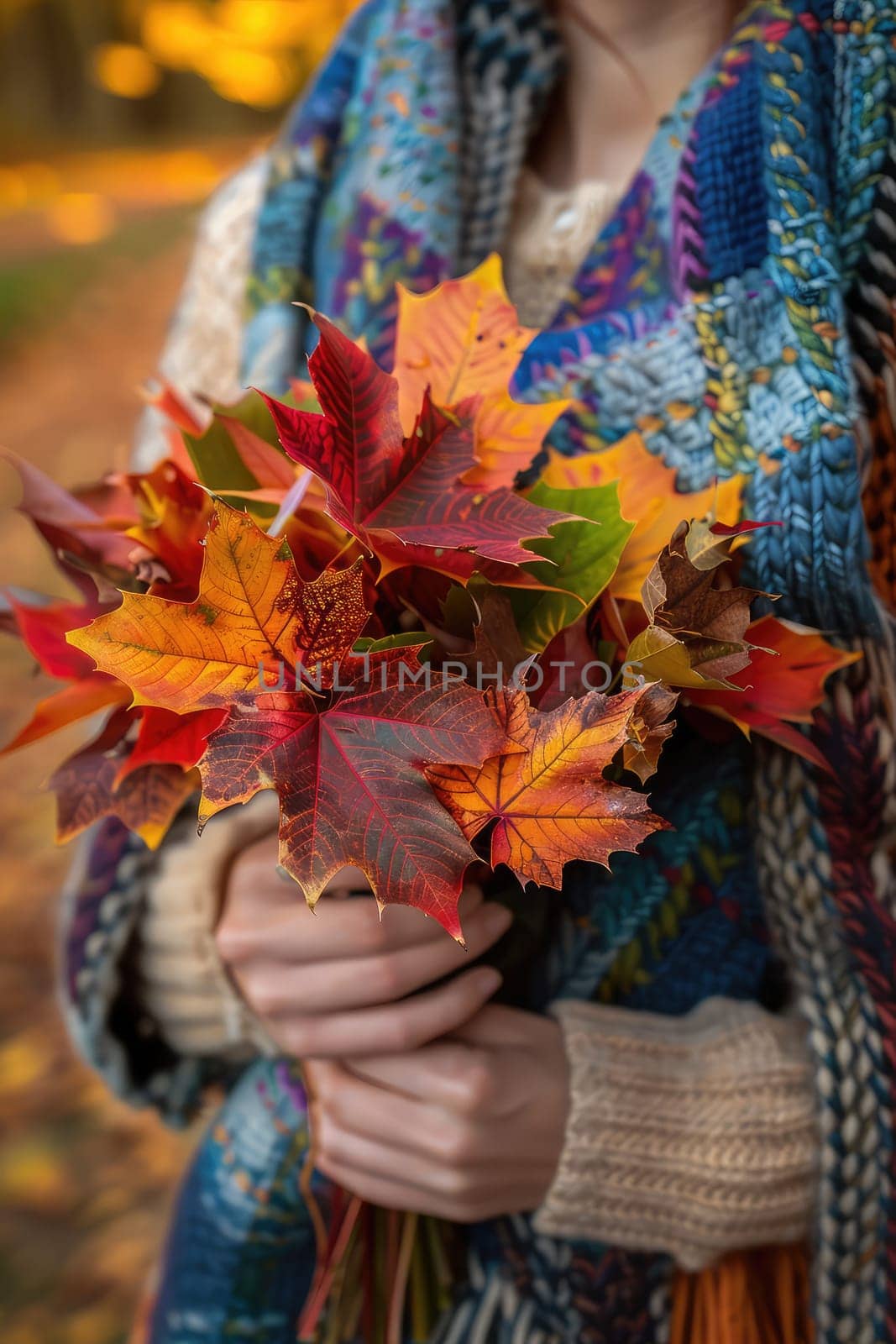 woman holds autumn leaves in her hands. Selective focus. nature.