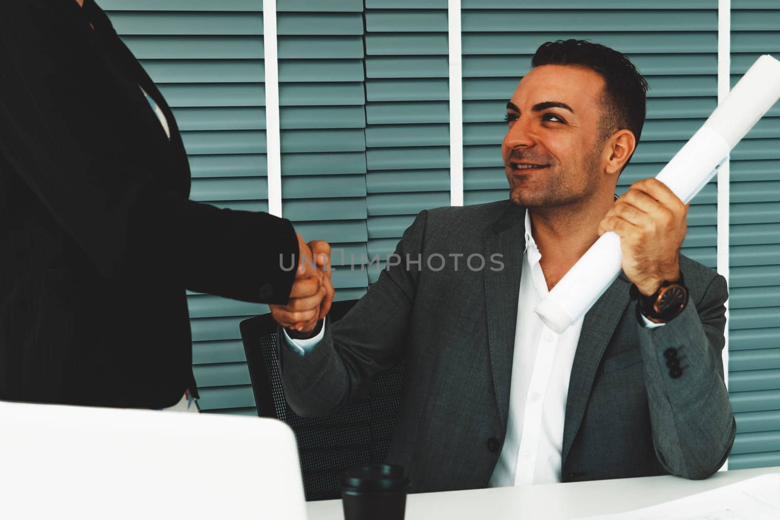 Businessman executive handshake with businesswoman worker in modern workplace office. People corporate business deals concept. uds