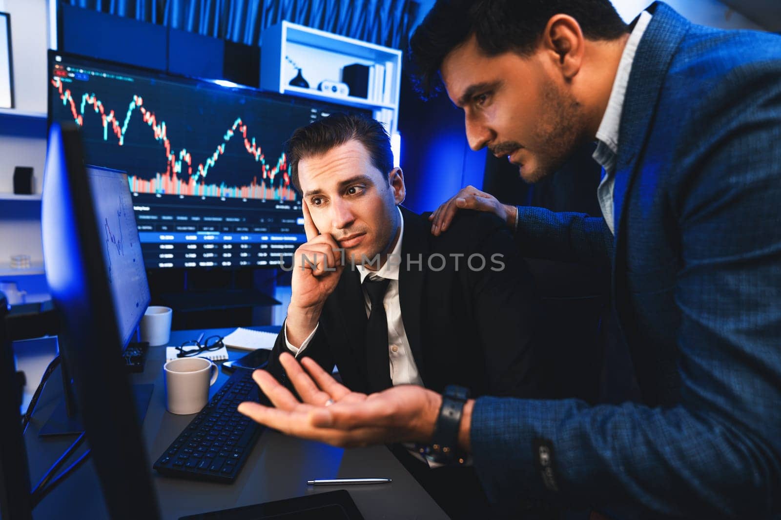 Stressful two stock investors with disappointed face focusing on dynamic currency market graph in recession stage. Traders discussing of lowest risk investing to make profit in solutions. Sellable.