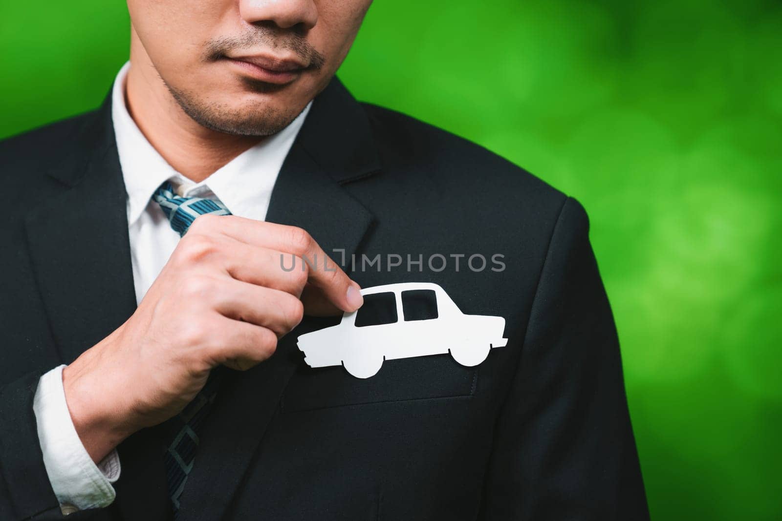 Businessman holding EV car icon symbolize eco-friendly business corporation committed to environmentally friendly transportation and zero CO2 emission. Corporate responsible and EV technology. Gyre
