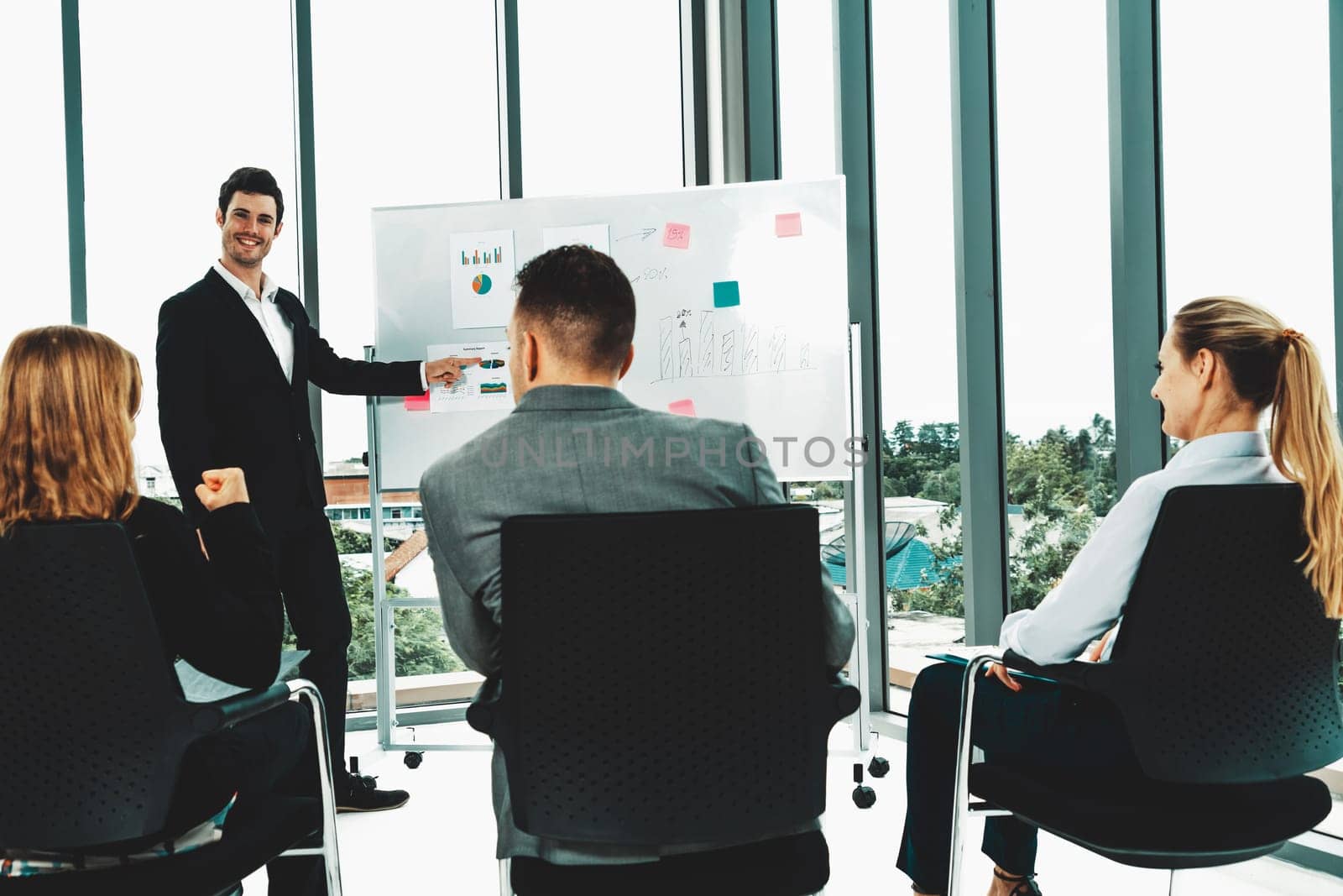 Businesswomen and businessmen attending group meeting conference in office room. Corporate business team concept. uds