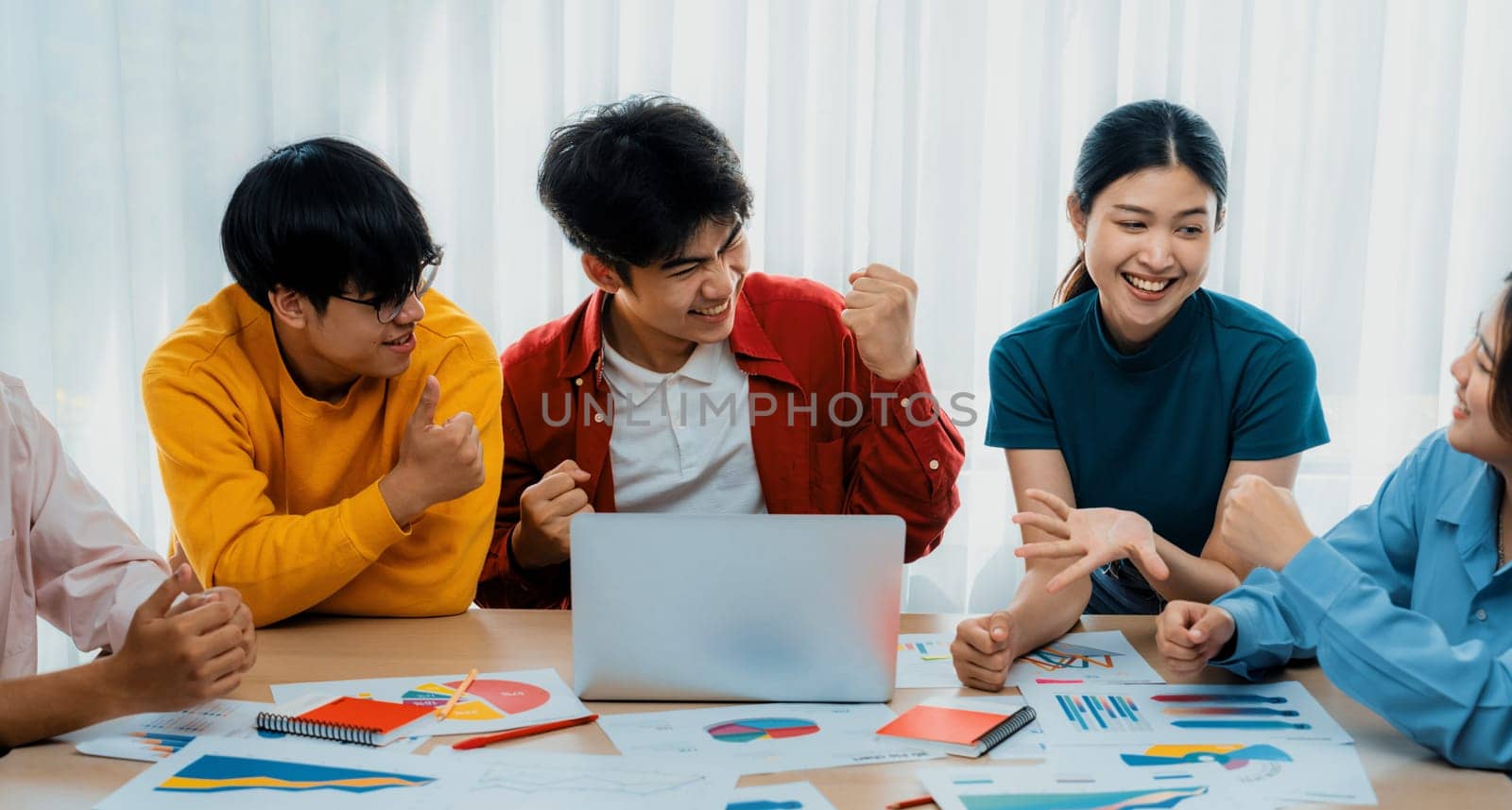 Excited and happy startup company employee celebrate after make successful strategic business marketing planning. Teamwork and positive attitude create productive and supportive workplace. Synergic