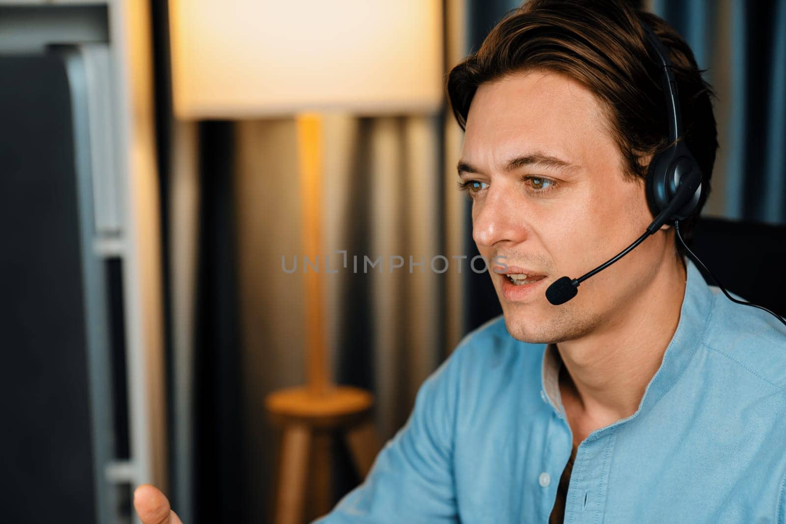 Call center consulting with customers on headphones on monitor in business paragraph with typing on pc with dynamic data marketing analysis planning at modern home office at night time. Pecuniary.
