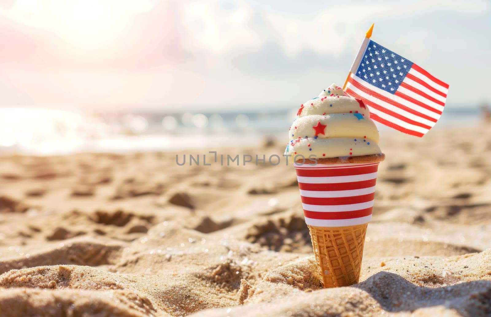 Ice cream cone with american flag in the sand on the beach on a sunny day