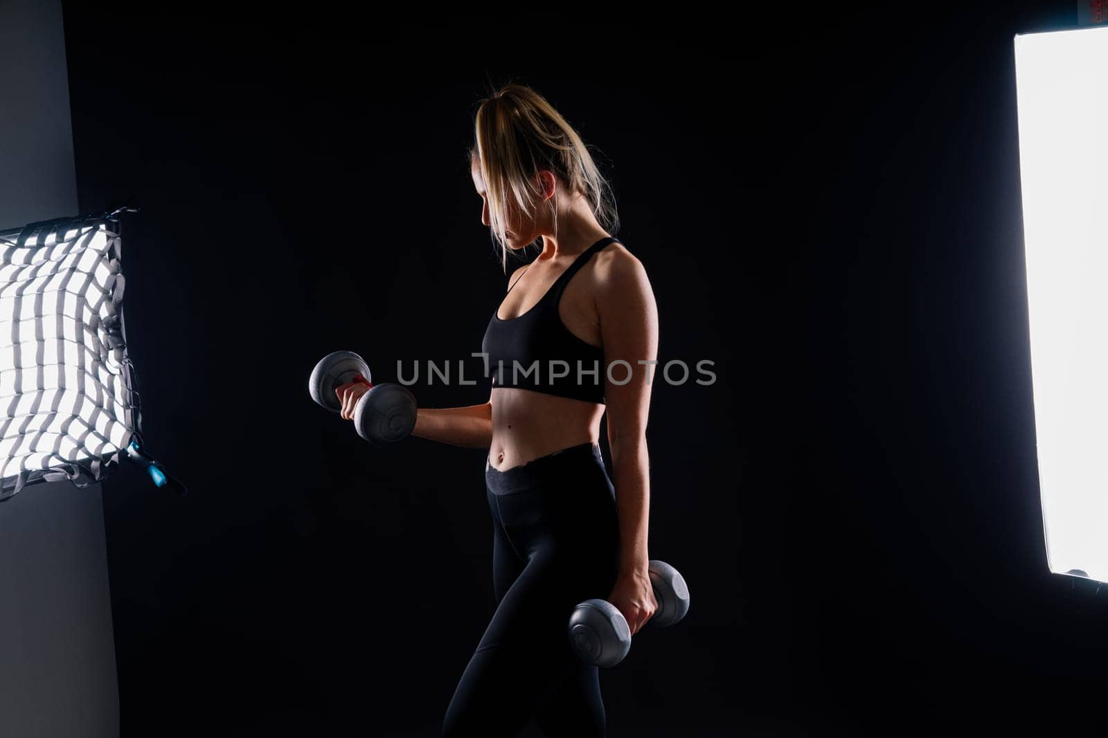 Middle aged woman doing fitness workout, standing in activewear with abs and muscles, smiling happy by Zelenin