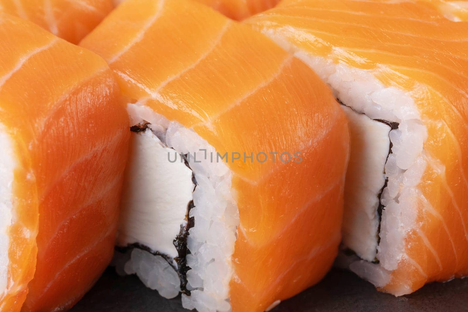 Philadelphia roll with salmon and cheese close-up.