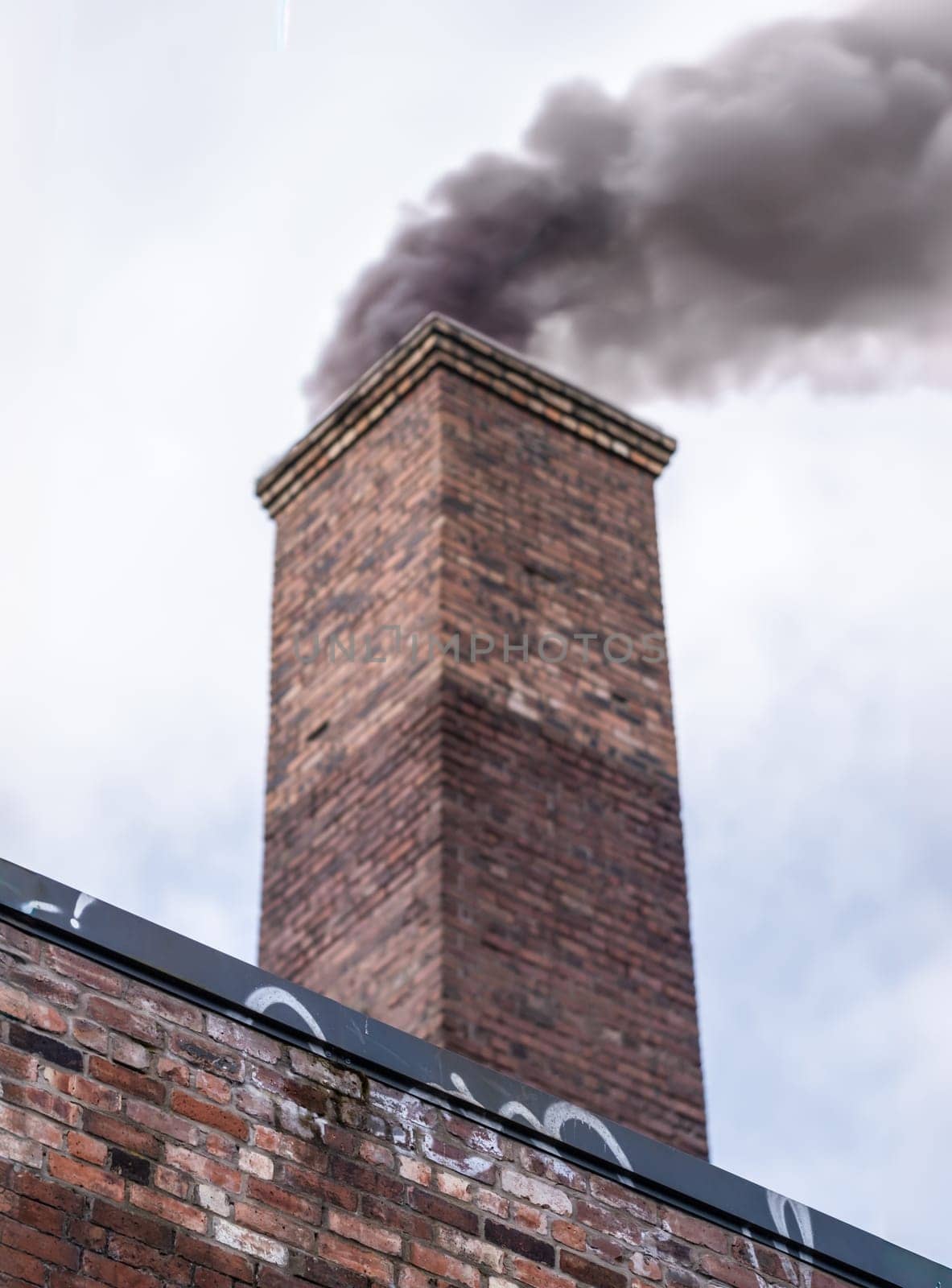 Smoke Pollution From An Old Industrial Factory Chimney, With Shallow Depth of Field