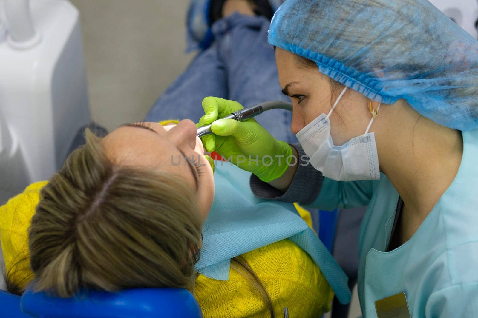 Dental health concept. female mouth on treatment in a dental clinic