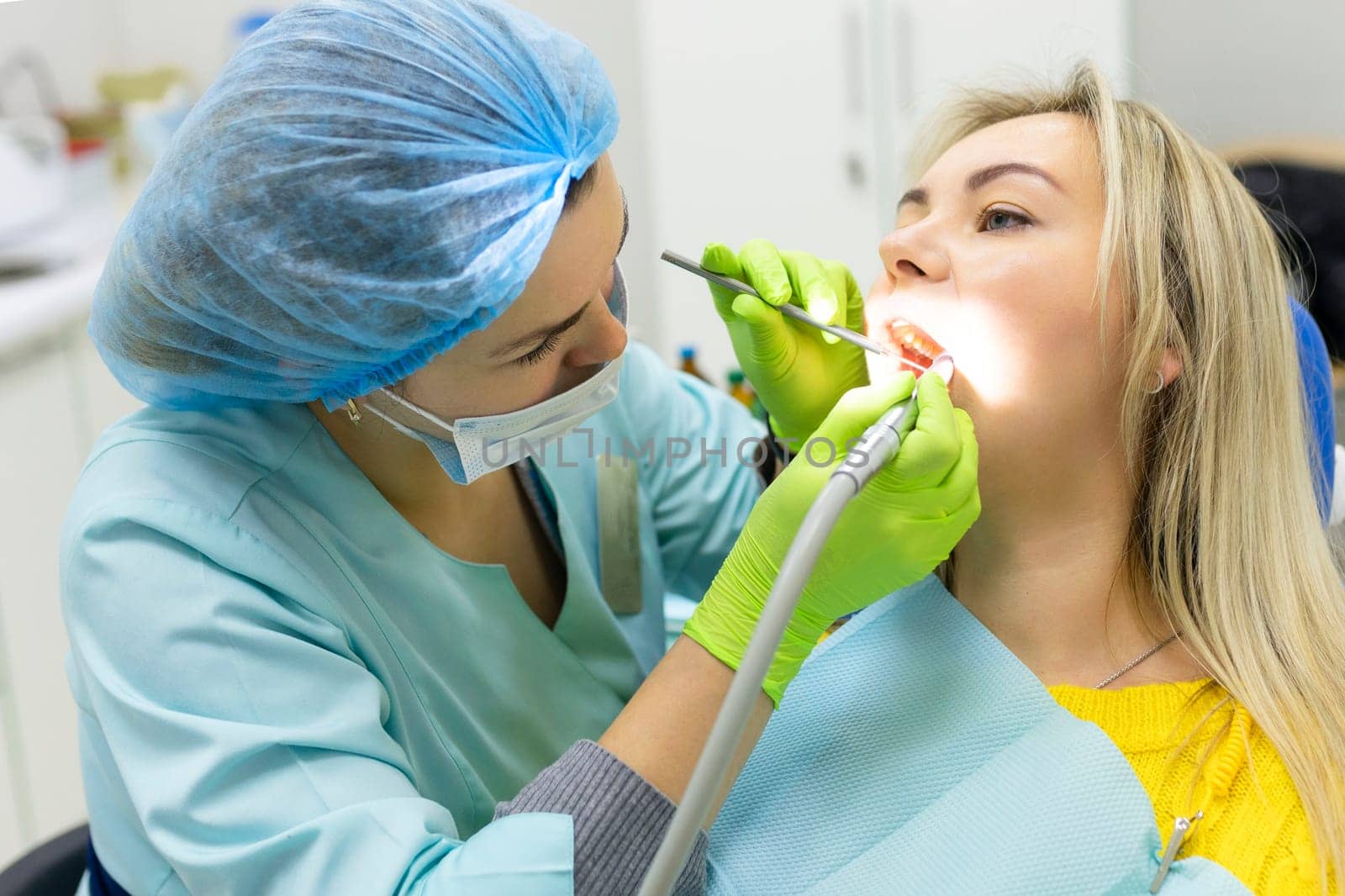 Dental health concept. female mouth on treatment in a dental clinic