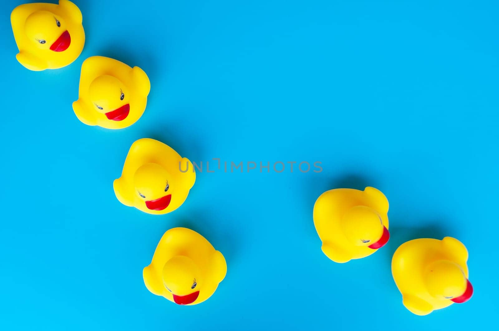 Top view of rubber ducks with customizable space for text.