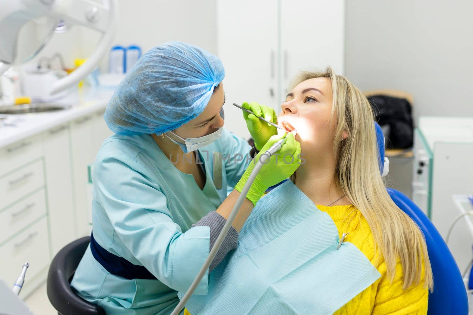 Dental health concept. female mouth on treatment in a dental clinic