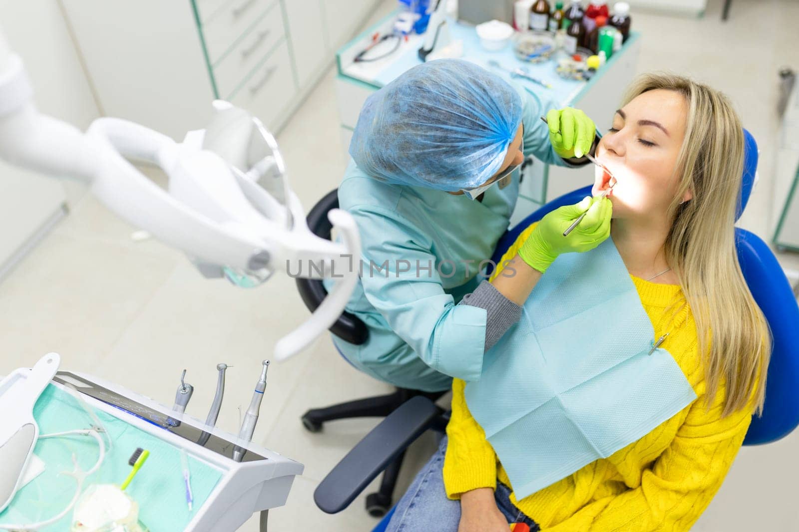 Dental health concept. female mouth on treatment in a dental clinic