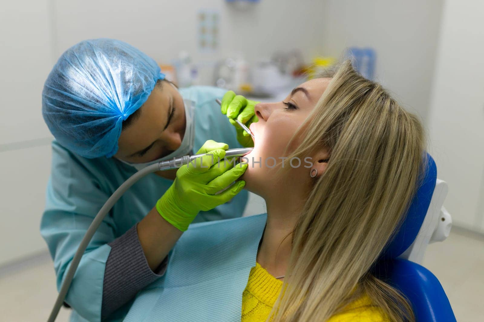 Dental health concept. female mouth on treatment in a dental clinic