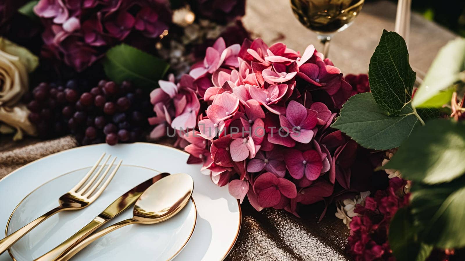 Wedding or formal dinner holiday celebration tablescape with hydrangea flowers in the English countryside garden, table setting and wine, floral table decor for family dinner party, home styling inspiration