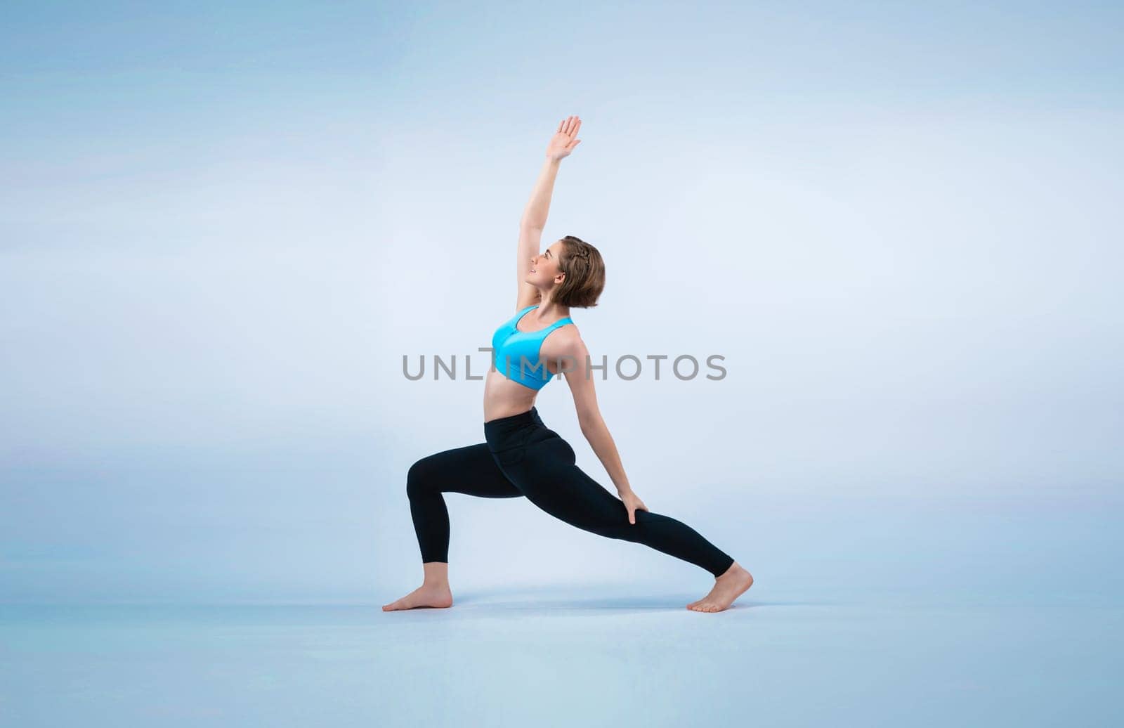 Full body length gaiety shot athletic and sporty woman doing healthy and meditative yoga exercise workout posture on isolated background. Healthy active and body care lifestyle