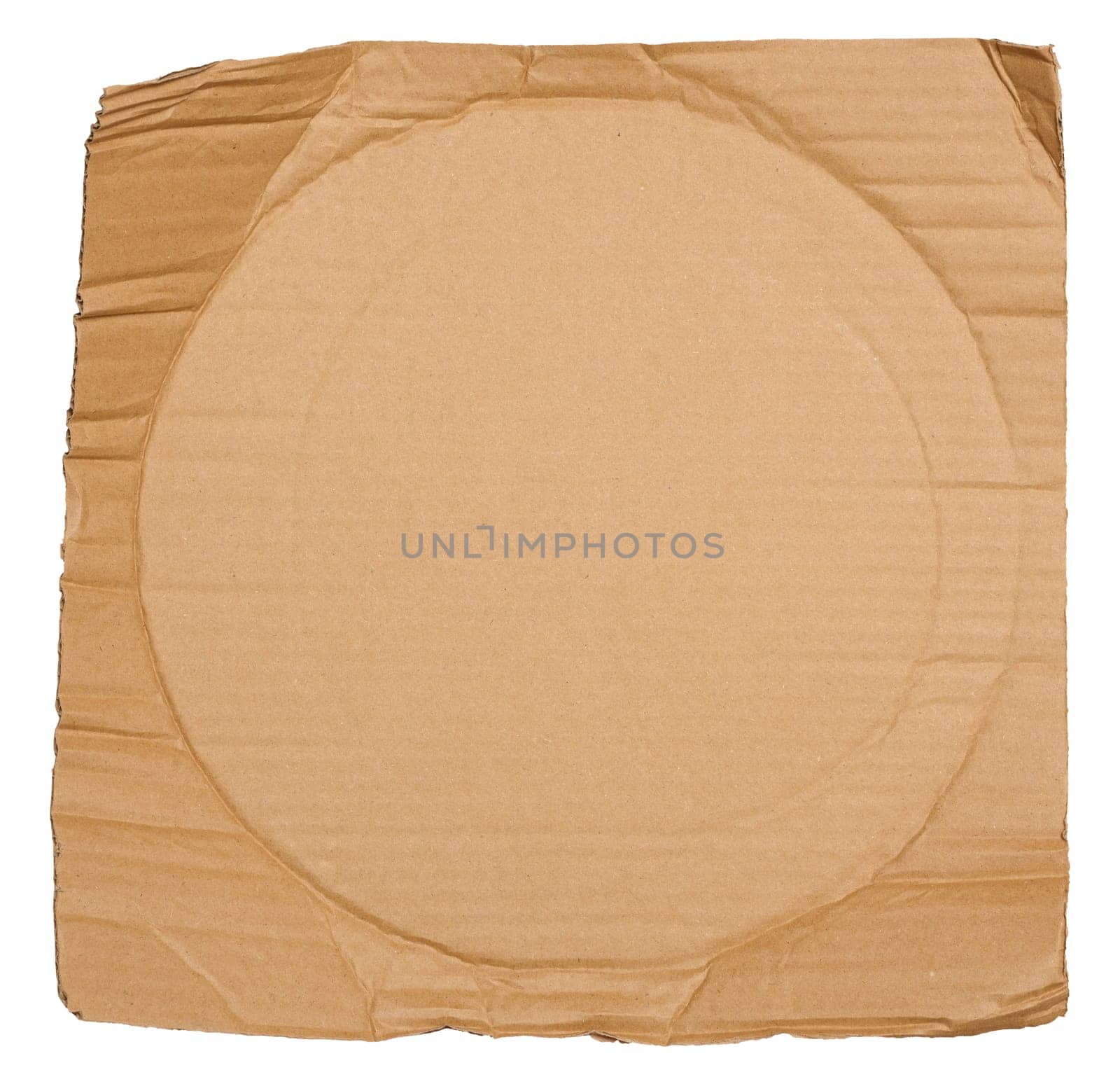 Piece of brown cardboard with torn edges on isolated background, close up