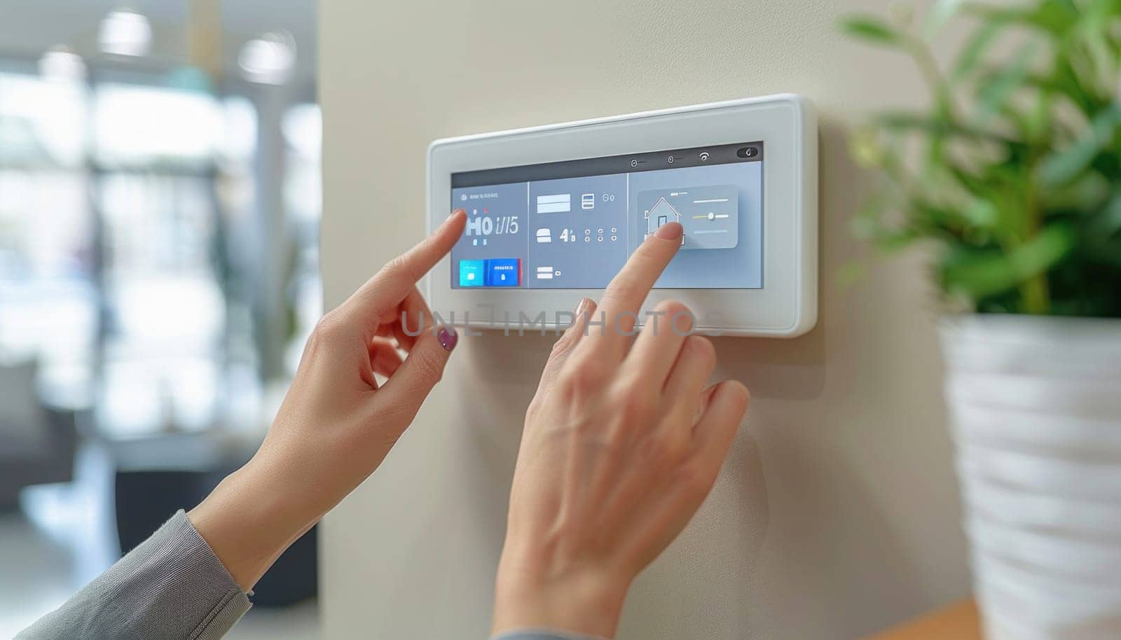A woman uses her finger to press a button on a security system, interacting with the display device