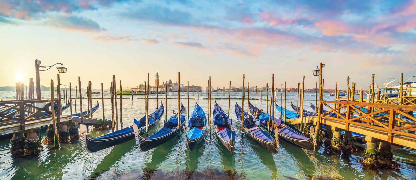 Venice cityscape and canal with gondolas  by f11photo