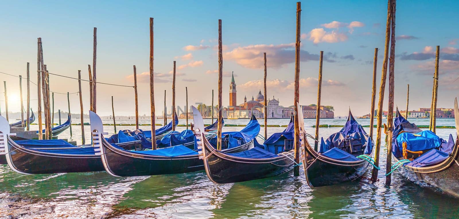 Venice cityscape and canal with gondolas  by f11photo