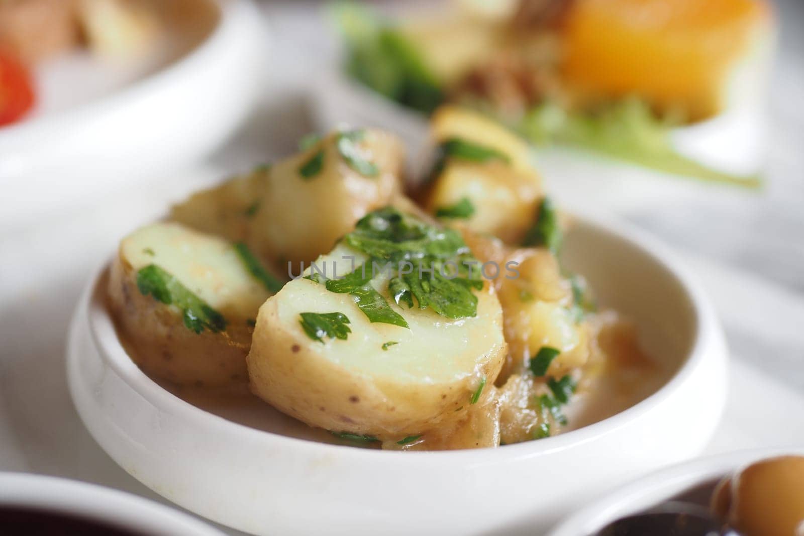 boiled potatoes on breakfast table .