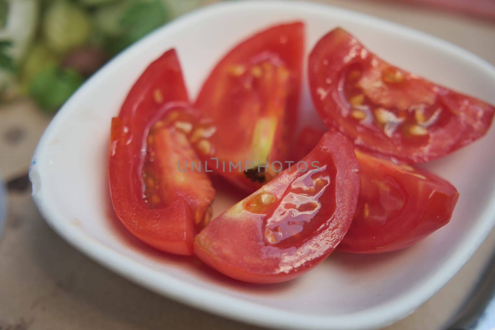 cherry tomato slices on table .