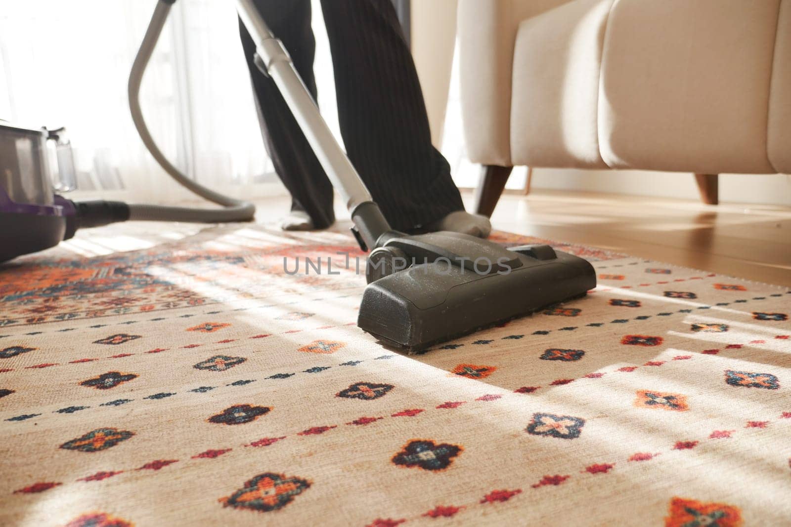 women cleaning with vacuum cleaner carpet