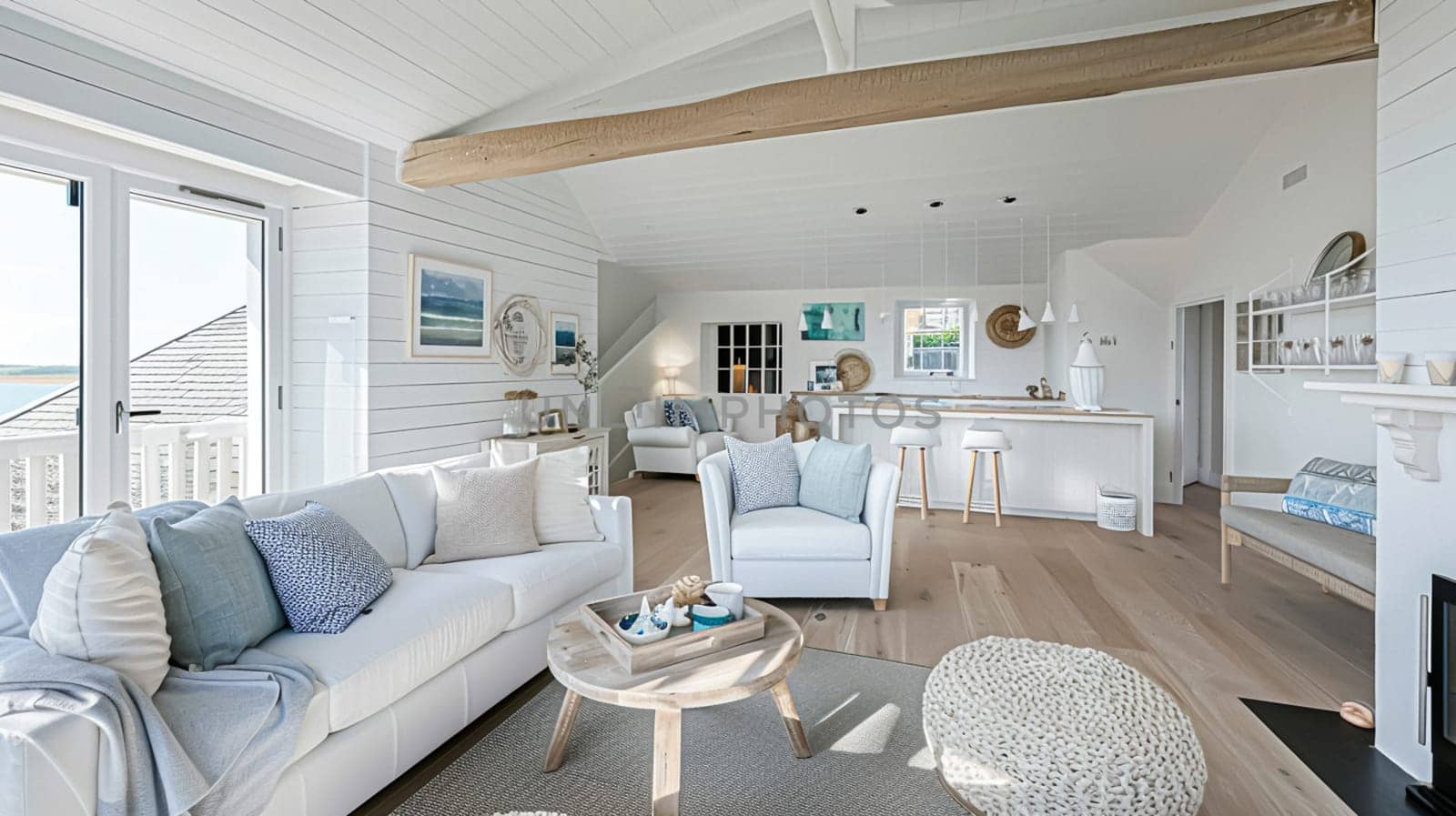 Interior of a living room with white walls, sofa and cushions. Sitting room in coastal cottage with sea view. Luxury lounge room