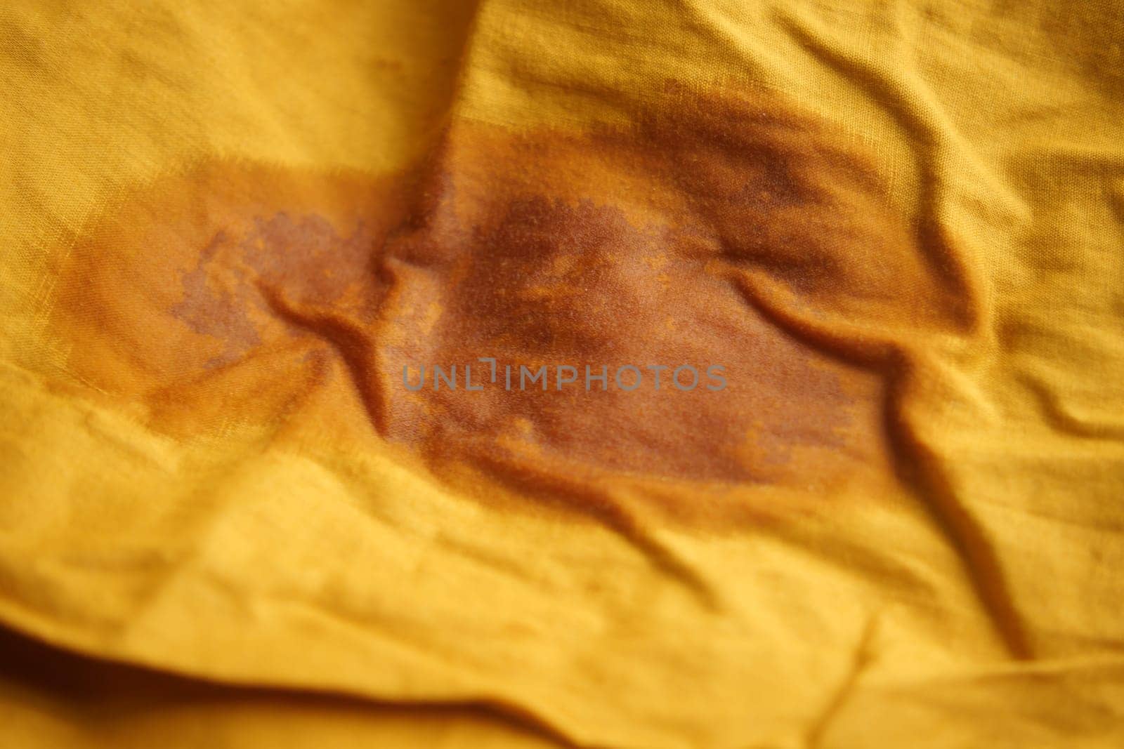 Oil stain on purple color cloth