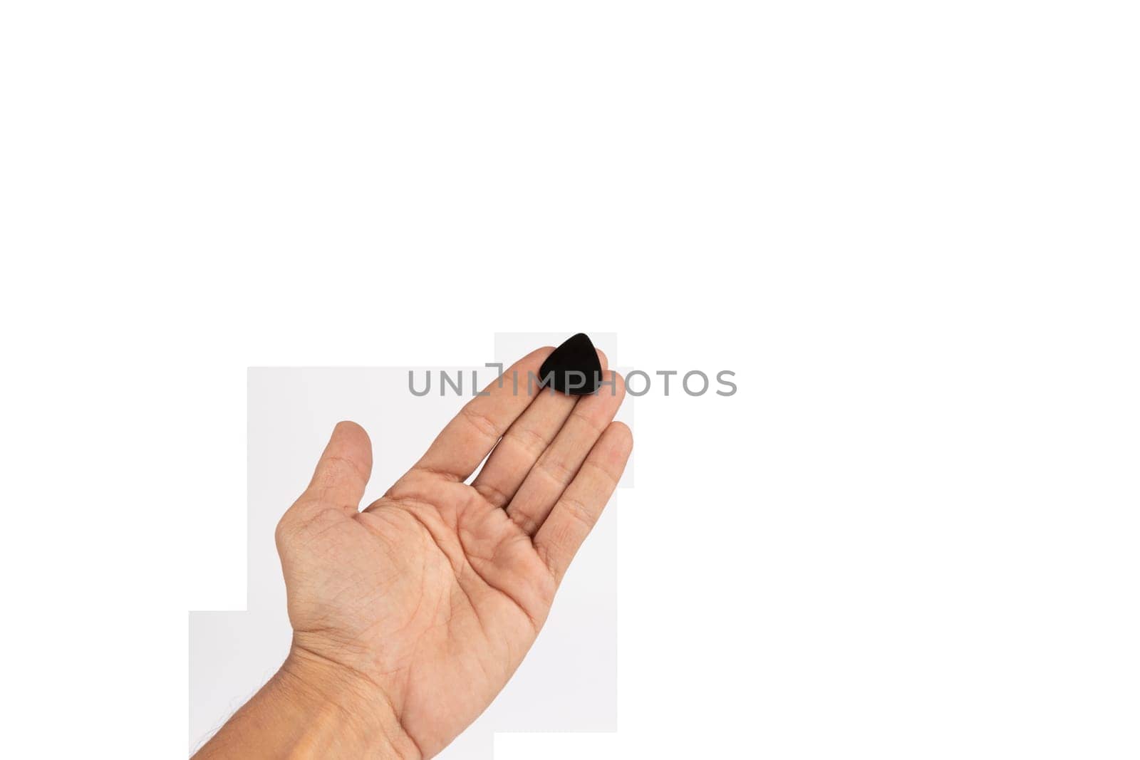 Black male hand offering a guitar pick isolated no background by TropicalNinjaStudio