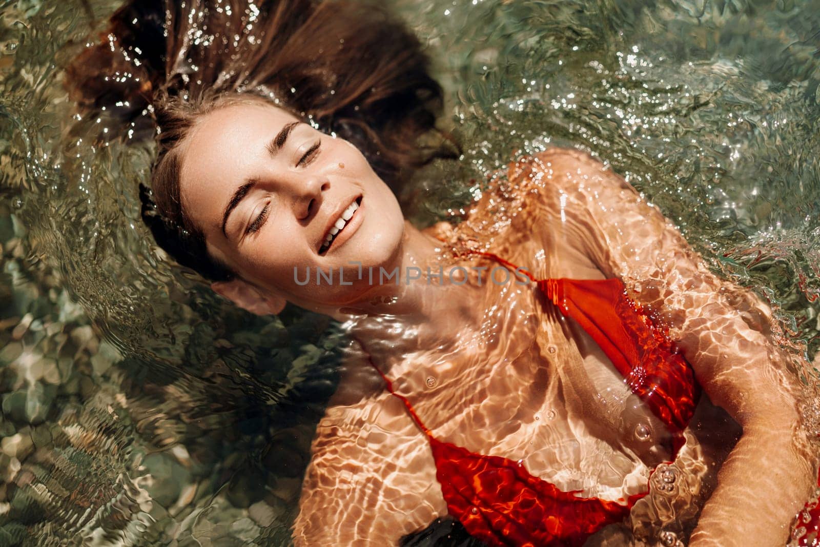 Happy woman sea relaxing floating in transparent sea water on summer holiday. Travel leisure recreation lifestyle, female in nature