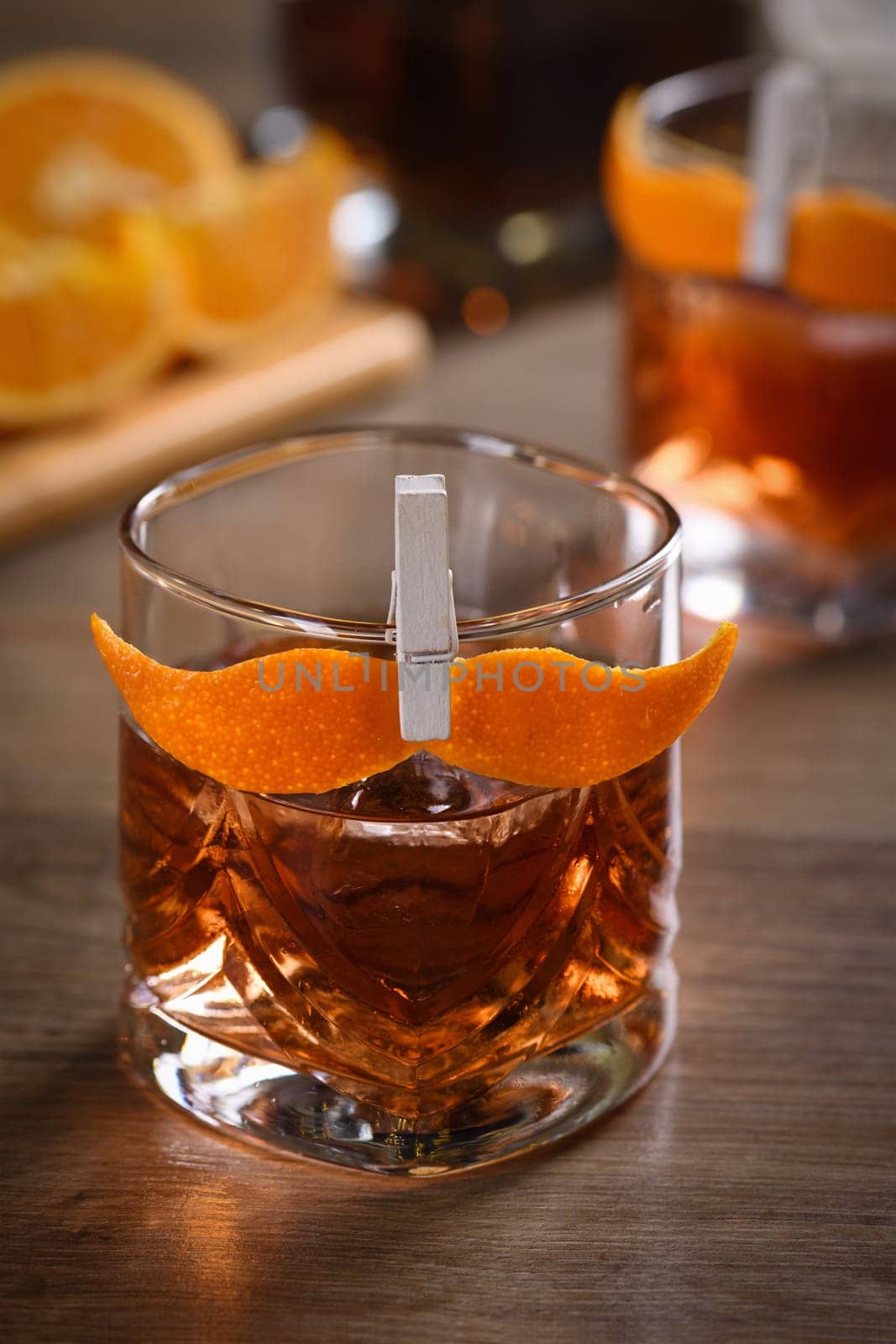 The Sharpie Mustache is a cocktail that's easy to make with equal parts rye whiskey, gin, sweet vermouth and a few drops of bitters, and garnished with a mustache-shaped orange zest