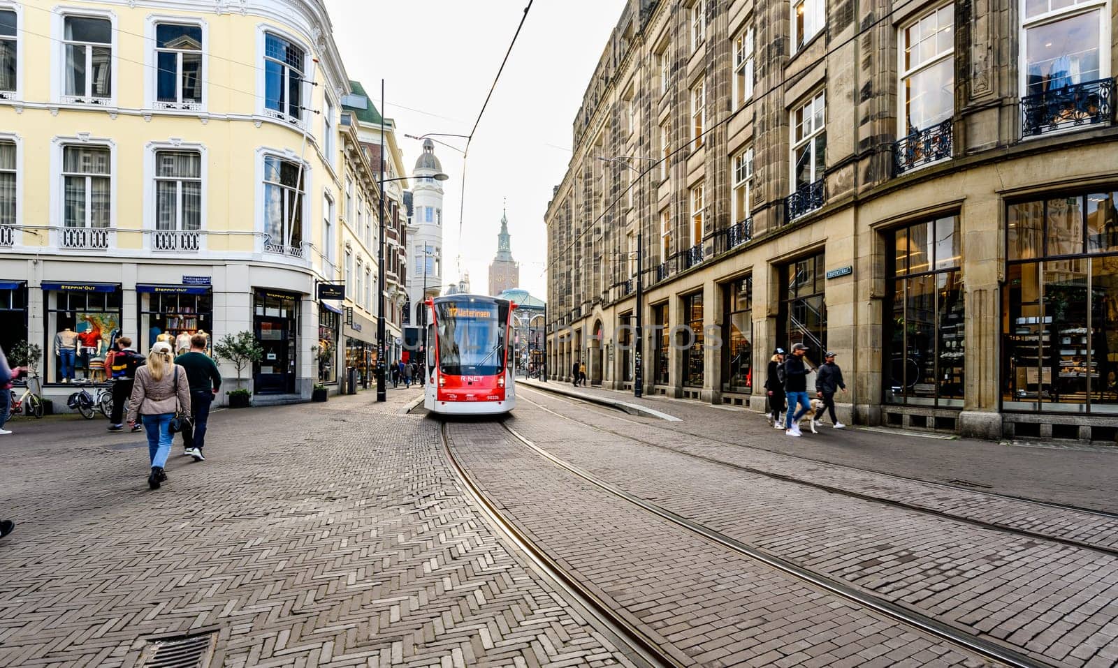 Hague, Netherland - 09 April 2023: tram rides on Rails in the center of Hague in Netherlands