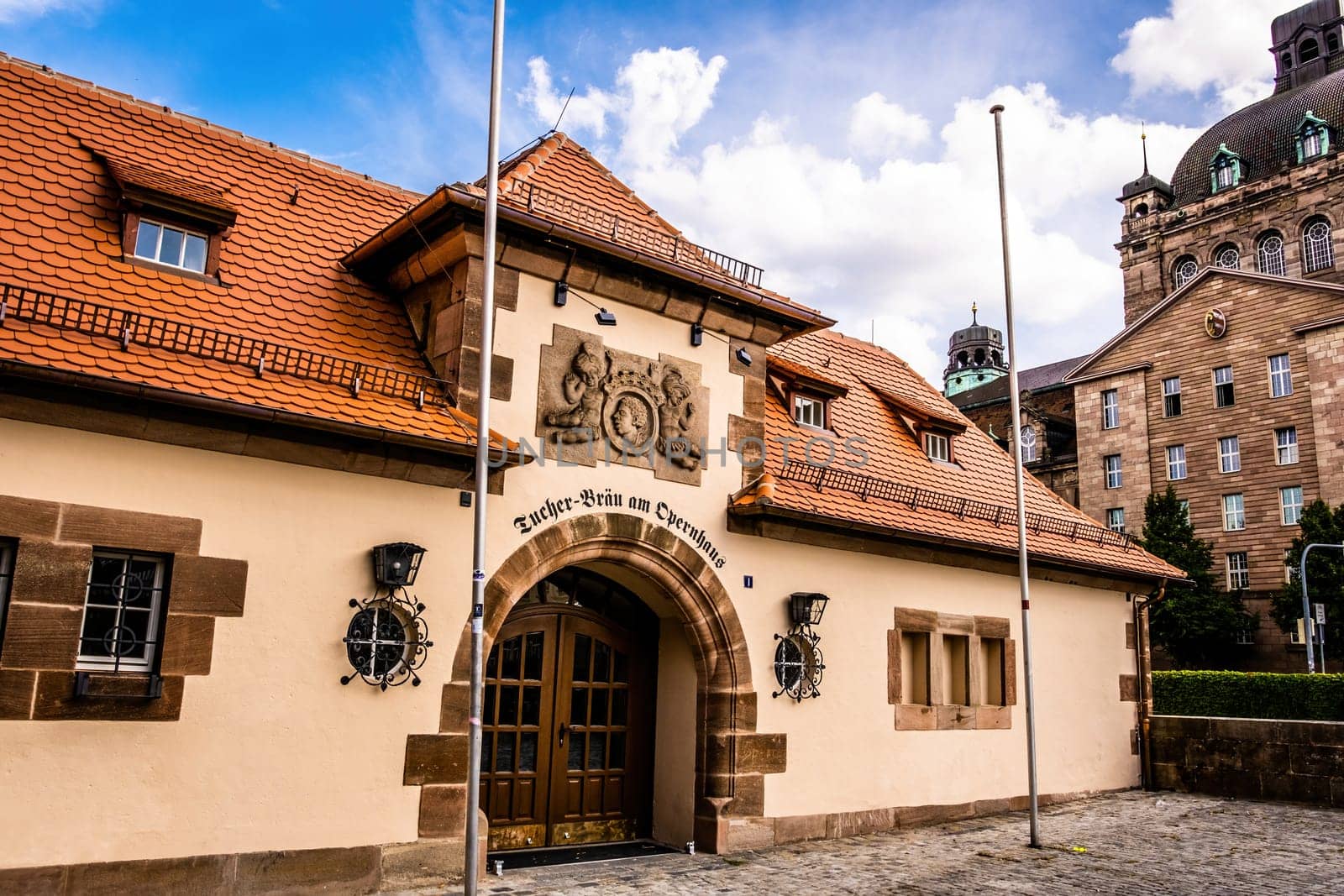 Nurnberg, Germany - 29 August 2022: Ancient building facade in old city center in Nuremberg, Germany. Historical house exterior and blue sky with clouds in Bavaria, Europe