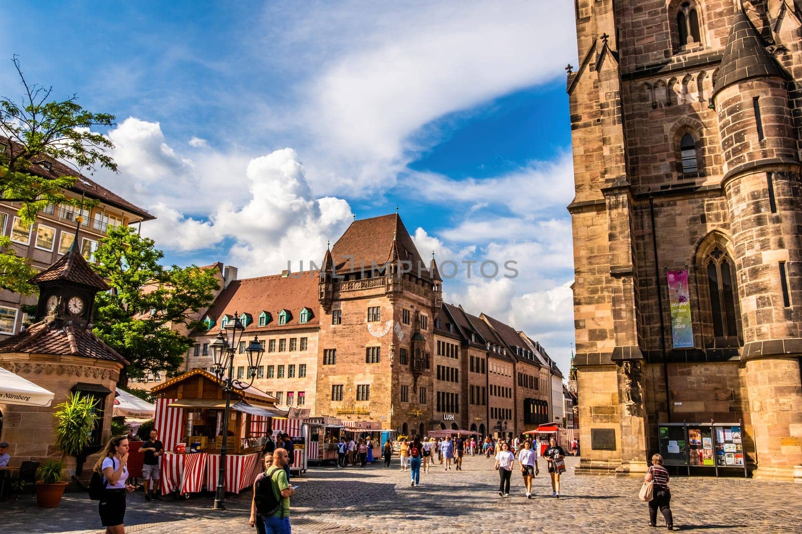 Nurnberg, Germany - 29 August 2022: Old city center in Nuremberg, Germany with ancient architecture buildings and tourists. Historical square in Bavaria, Europe with beautiful houses