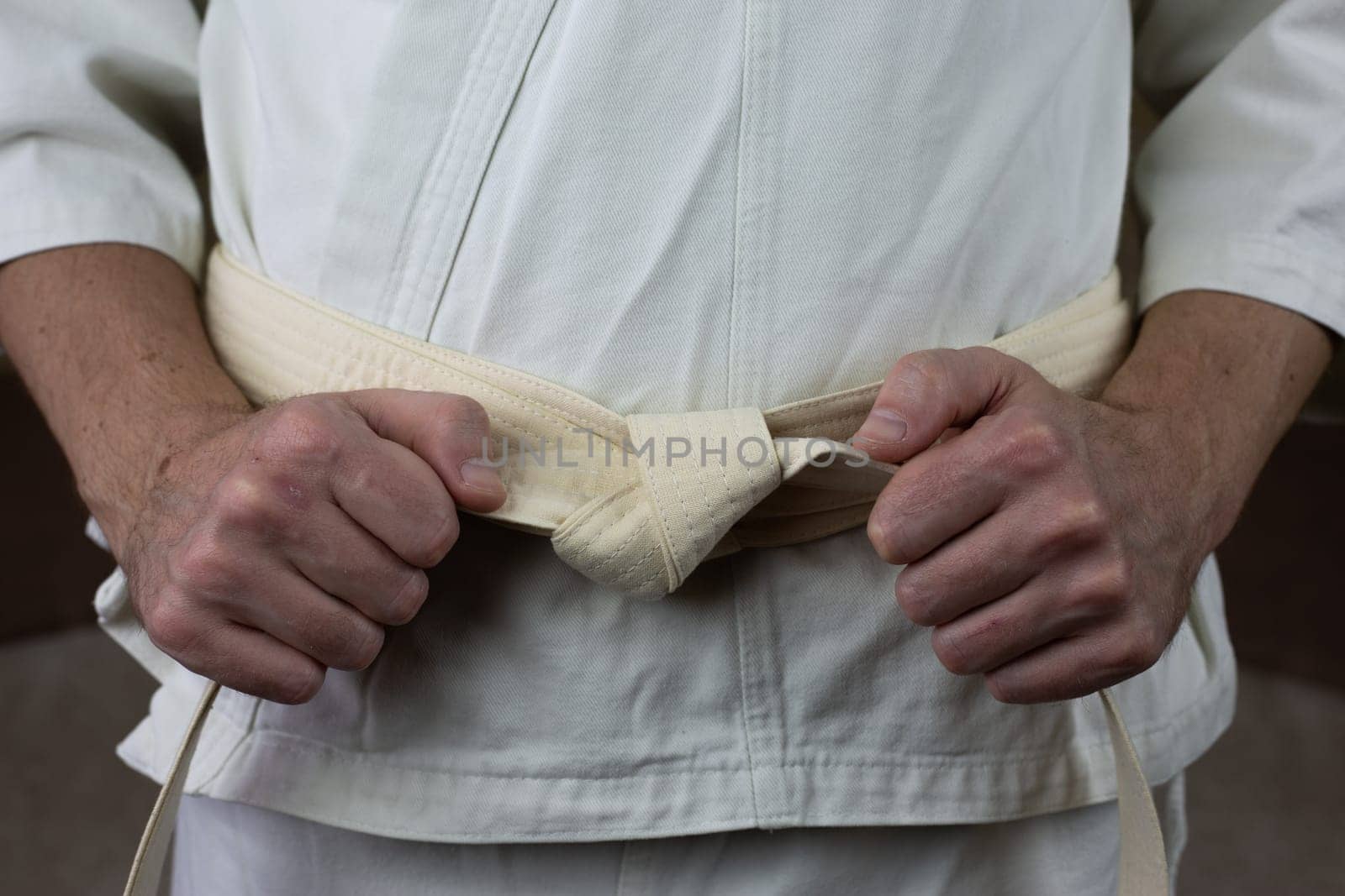 White belt of an athlete in Kyokushin karate by timurmalazoniia