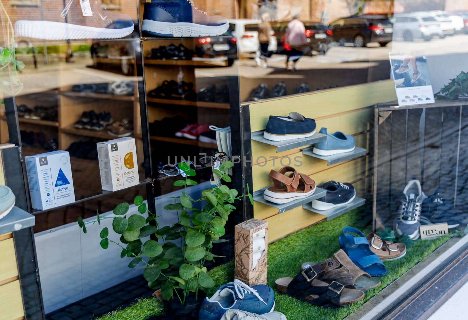 Showcase window of a shoe store in the city of Ystad, Sweden - May 25, 2024.
