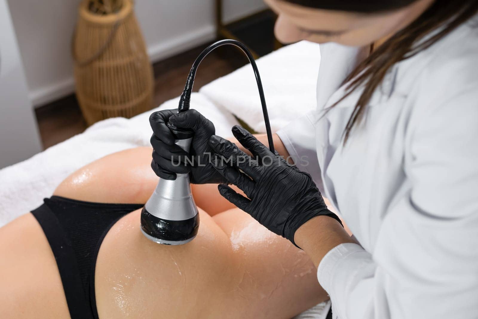 A young woman experiencing body contouring through ultrasound cavitation