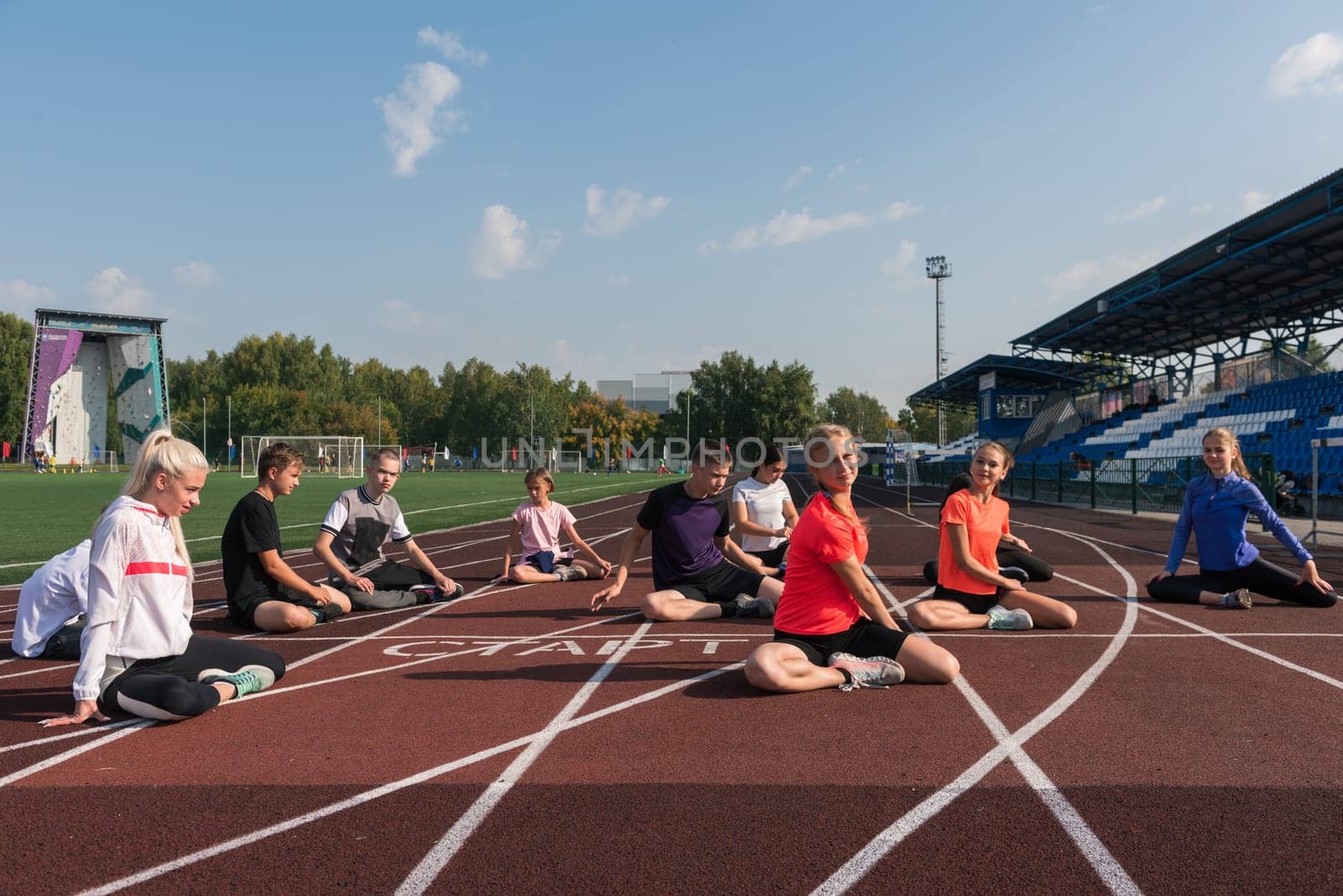 Group of children training at the stadium outdoors