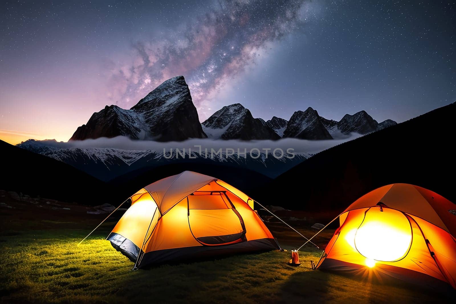 Camping tent high in the mountains at sunset.