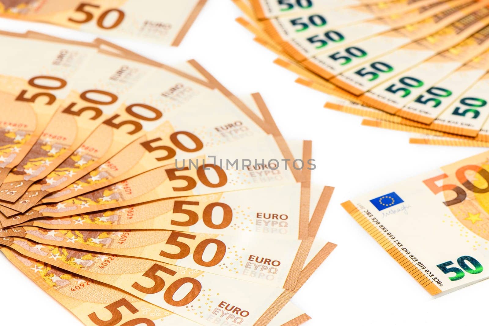 50 euro bills spread out in the shape of a fan. Isolated on white background. by Mixa74