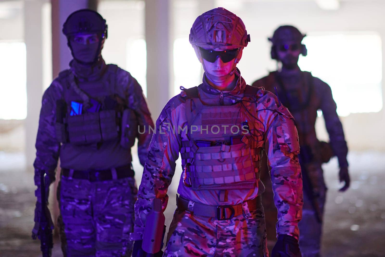 soldier squad team walking in urban environment colored lightis.