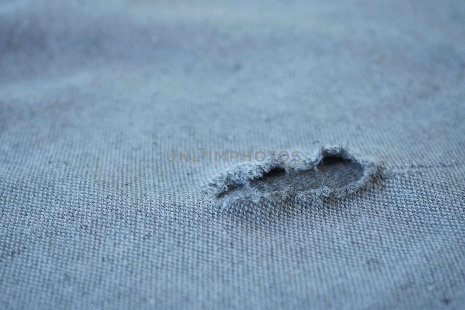 hole in the clothes. Close-up