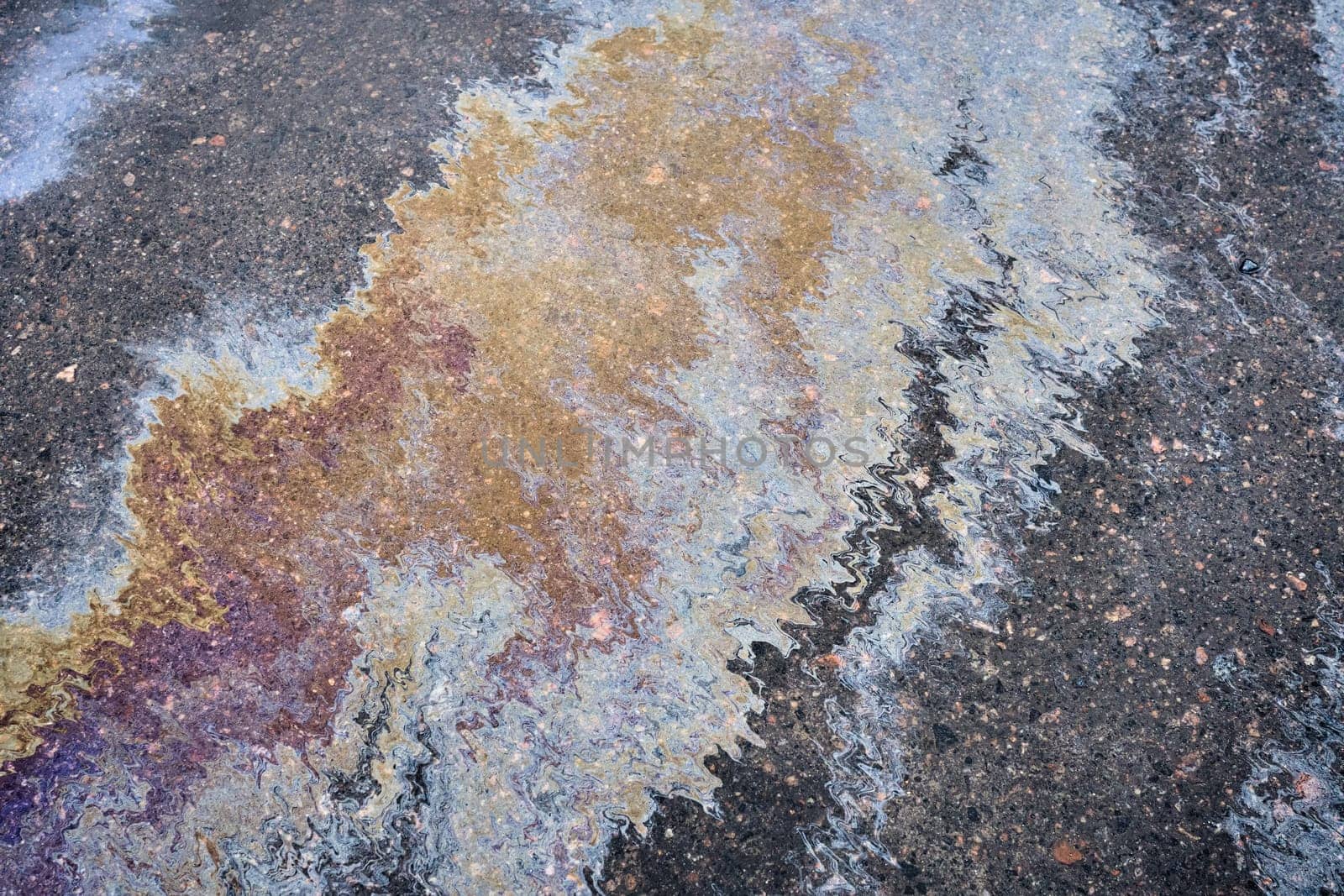 Slick industry oil fuel spilling water pollution. Water with patches of gasoline and oil