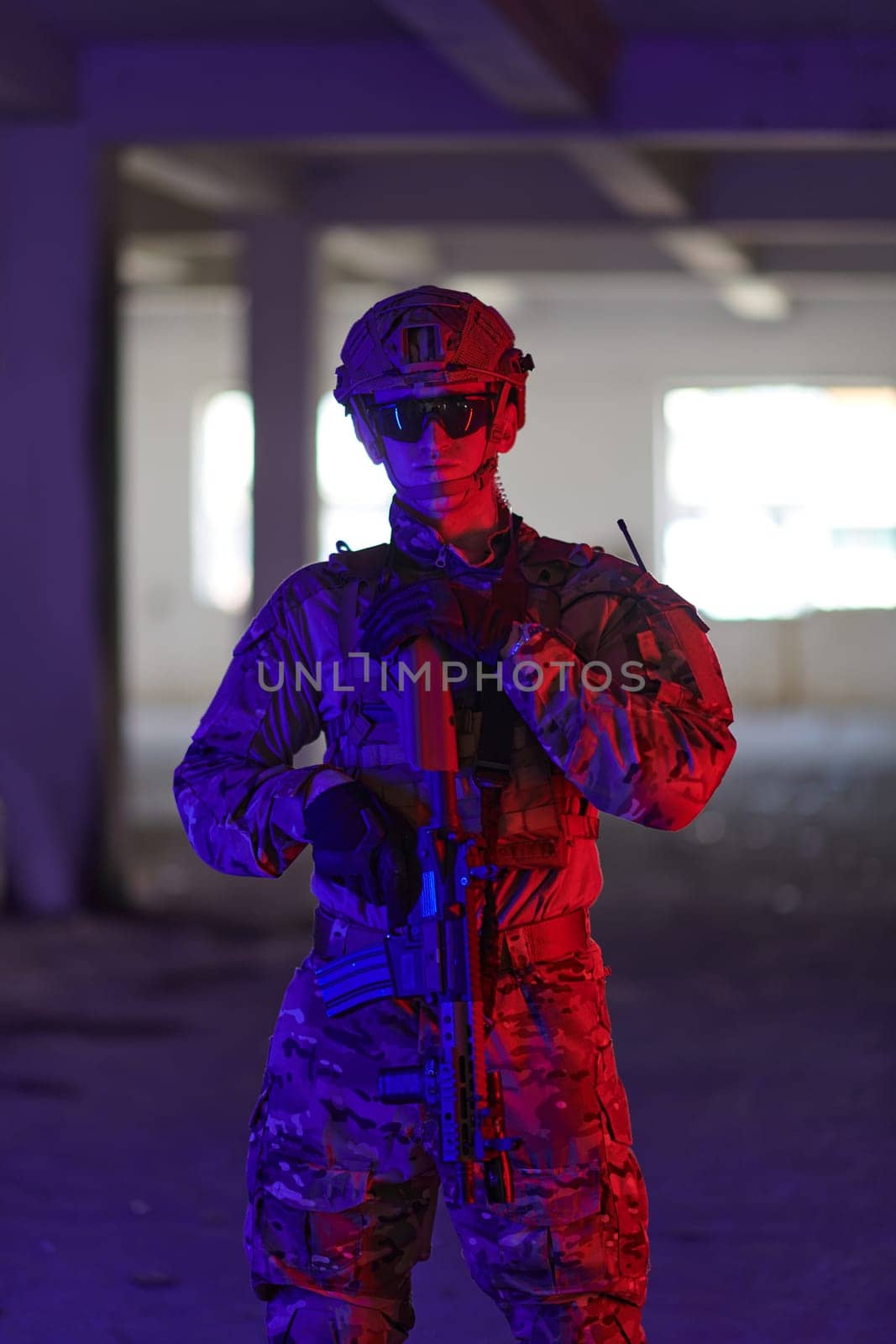 A professional soldier undertakes a perilous mission in an abandoned building illuminated by neon blue and purple lights by dotshock