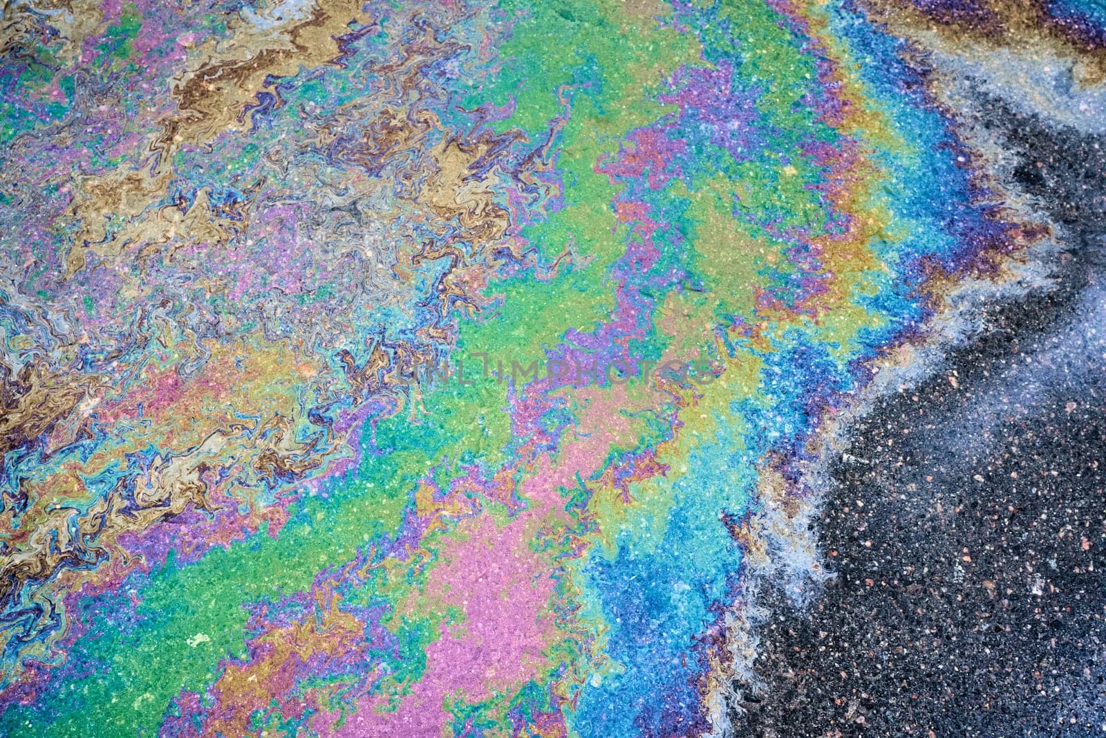 Oil stain, Gas Stain drop from the Car on the Parking Lot Floor.