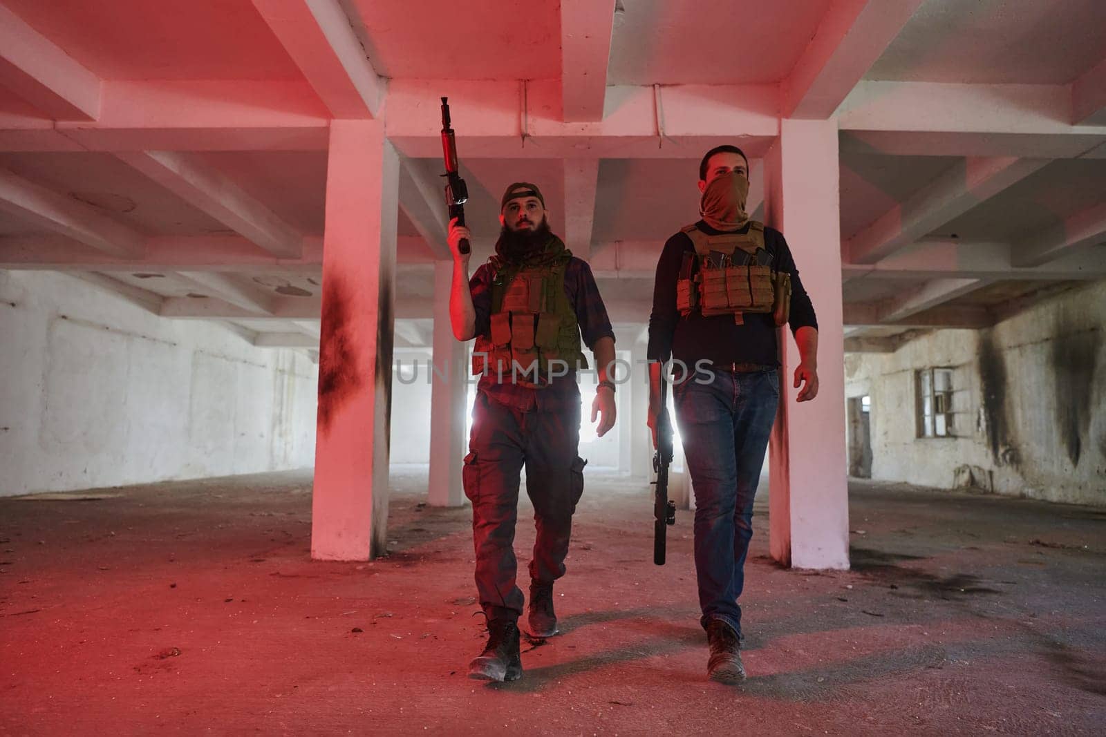 An abandoned building serves as the stronghold for a team of terrorists, fiercely guarding their occupied territory with guns and military equipment.